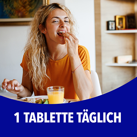 Frau beim Frühstück, 1 Tablette täglich